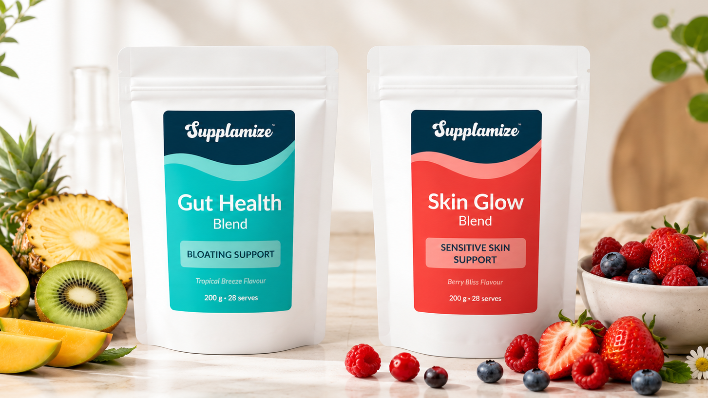 Supplement packages labeled 'Gut Health Blend' and 'Skin Glow Blend' on a table with fruits and berries.
